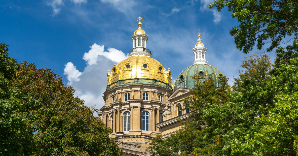 Image of the gold dome on the Iowa Capitol building against a blue sky background. 